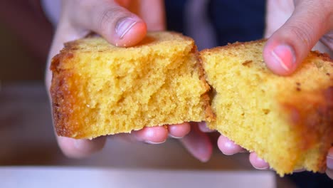 person holding a slice of cake