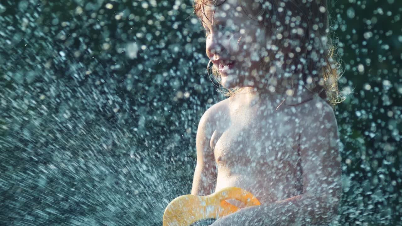 Child Playing with Sprinkler on a Sunny Day