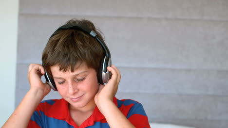 Dancing-young-boy-enjoying-music-with-headphones