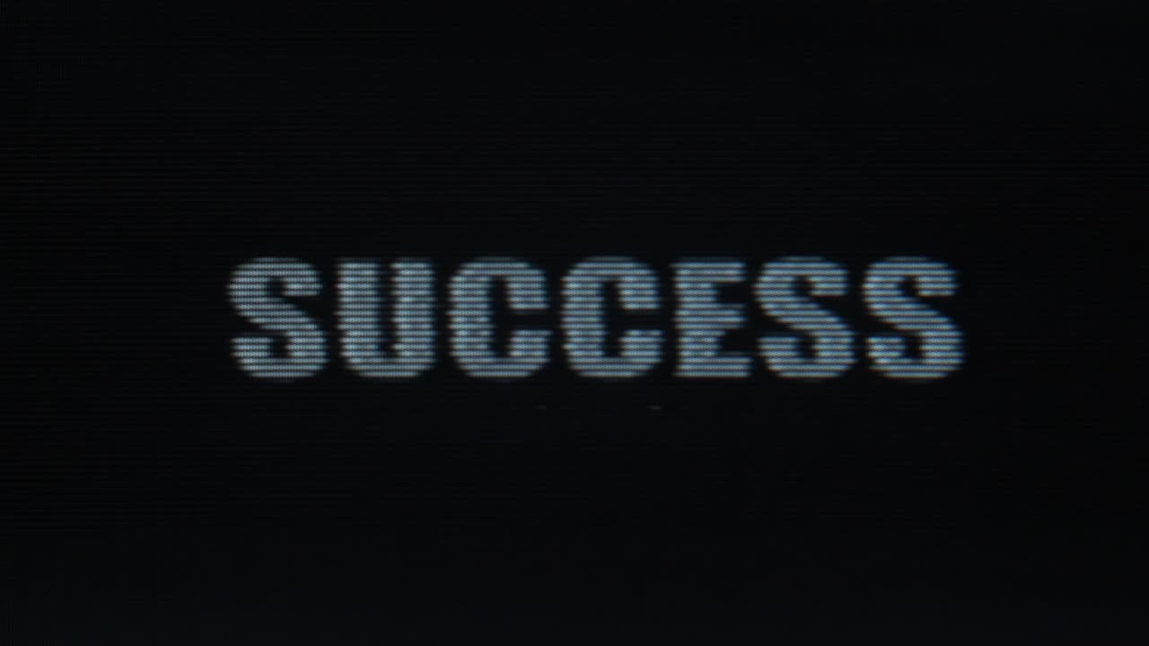 Glitchy Success text message on distorted vintage screen - retro CRT cathode ray tube VHS VCR Gaming 80s technology concept