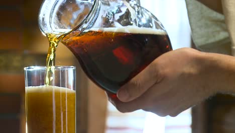 pouring beer into a glass