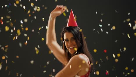 Young-woman-dancing-in-party-hat