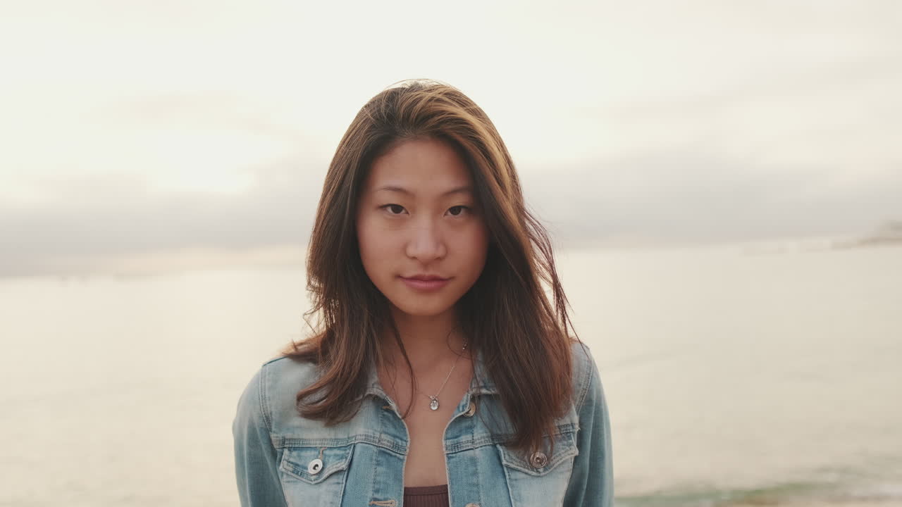 Portrait of a young Asian woman at the beach