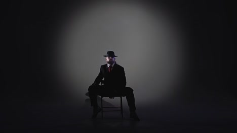 mysterious man in spotlight