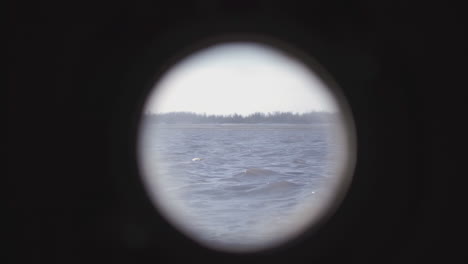 view of a river through a hole