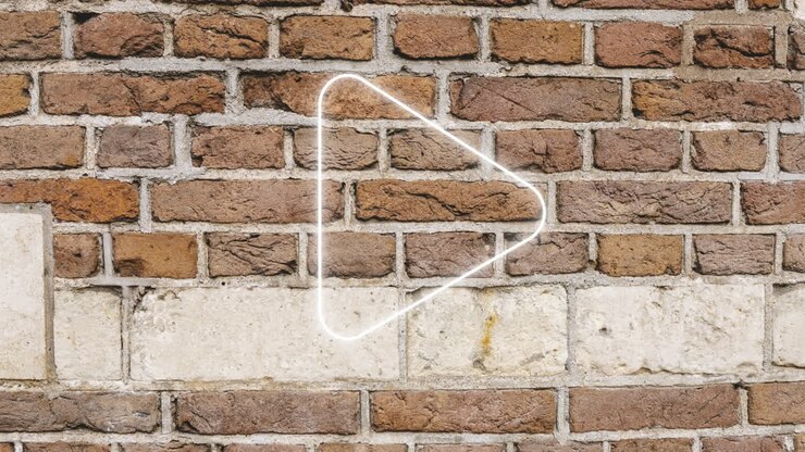 Animation of glowing neon arrow icon on brick wall