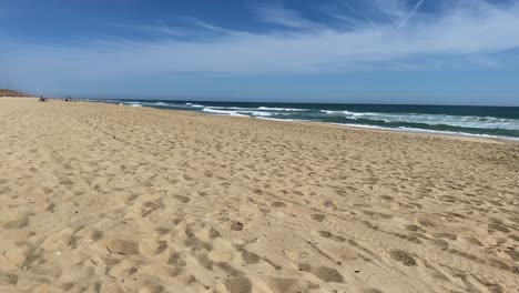 Beautiful-sunny-day-on-a-calm-pristine-beach-with-blue-skies-in-North-Carolina-in-the-Outer-Banks-in-Nags-Head-during-early-summer