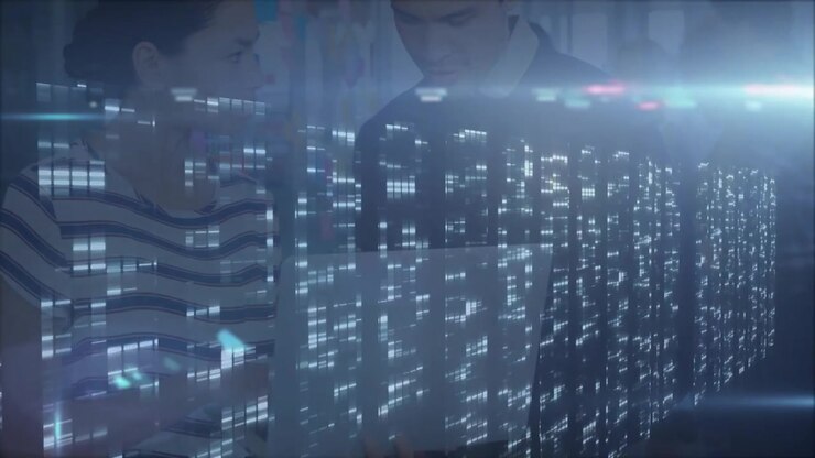 Woman and man team members reviewing business data in office, showing holographic matrix projection