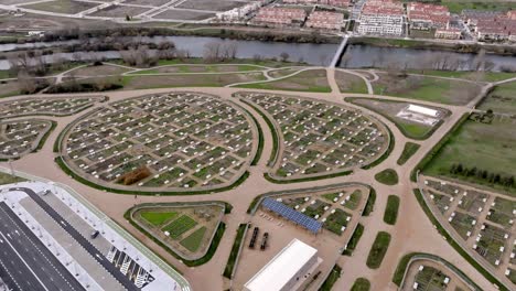 aerial shit of urban farm, green fields near residential area,salamanca, spain