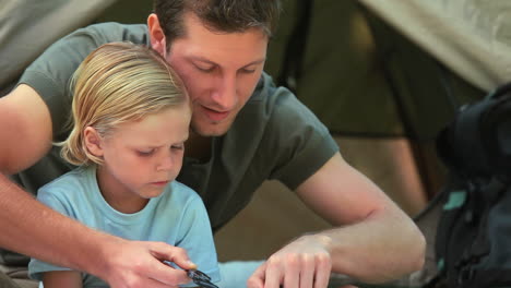 father explaining how to read a compass