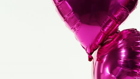 purple balloons floating in the air 4k