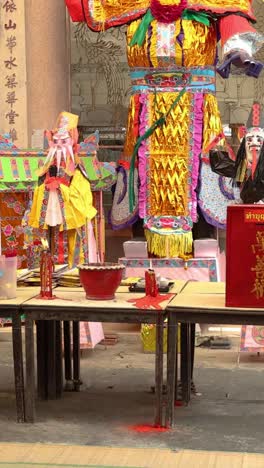 colorful chinese dolls in a temple setting