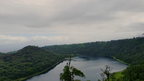 laguna de hule volcanic lake in costa rica rainforest