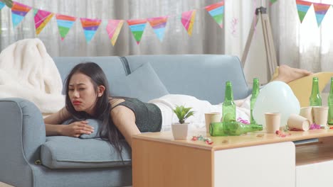 woman feeling the aftermath of a party