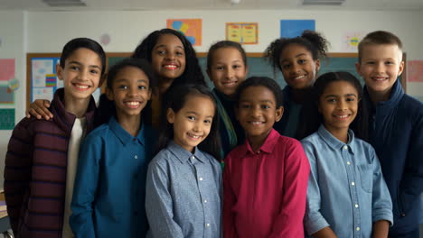 happy diverse group of elementary school children in a classroom