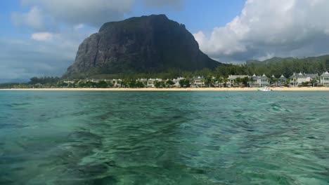 mauritius - travel paradise, pan left from the ocean water within the le morne brabant, the popular mountain of the beautiful island.