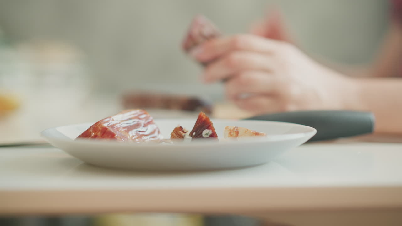 Woman eating meal in kitchen