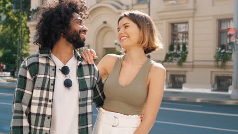 couple walking through city street