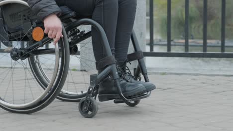 person in a wheelchair walking outside