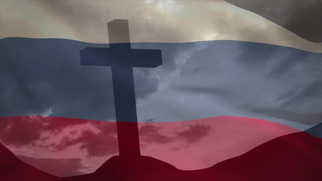 Vind får hvid-blå-rødt flag til at bølge hen over bakketopskorssilhuet og skaber en rolig hyldest.