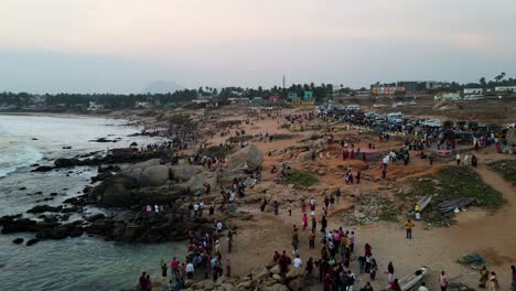 breathtaking aerial drone shot of kanyakumari with the city and ocean bathed in warm sunset colors.