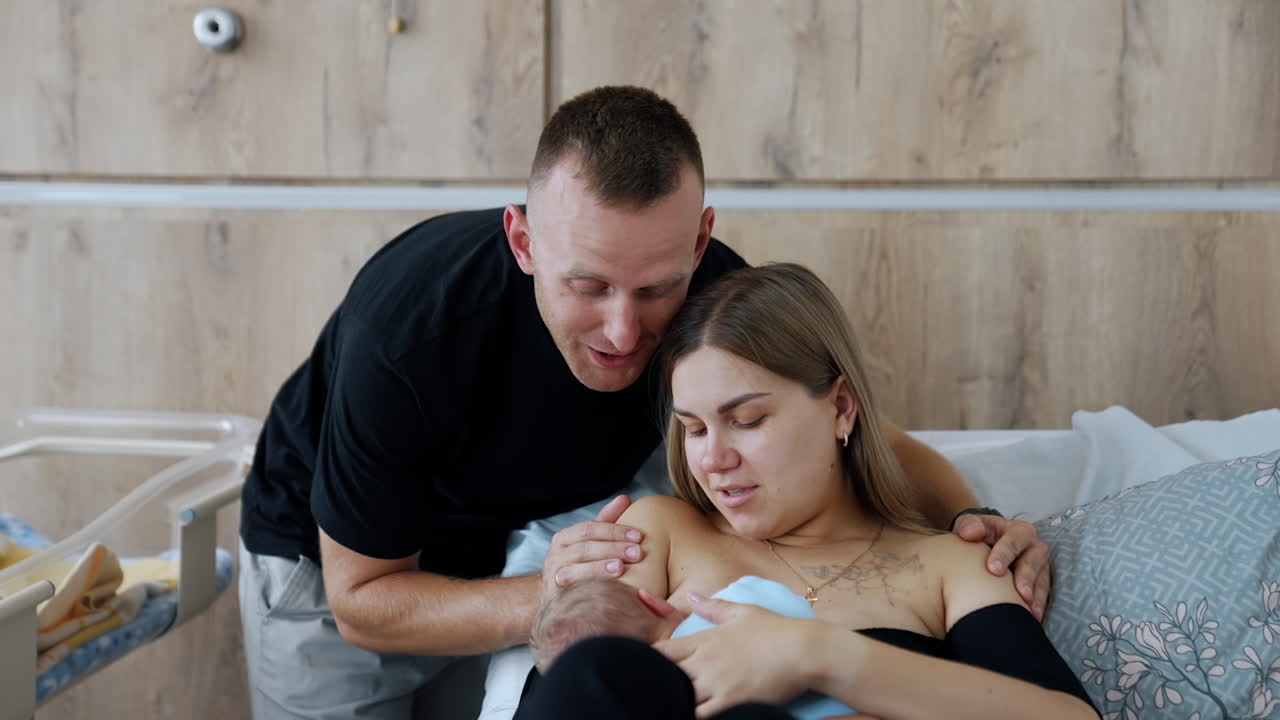 Newborn Baby Being Breastfed By Mother