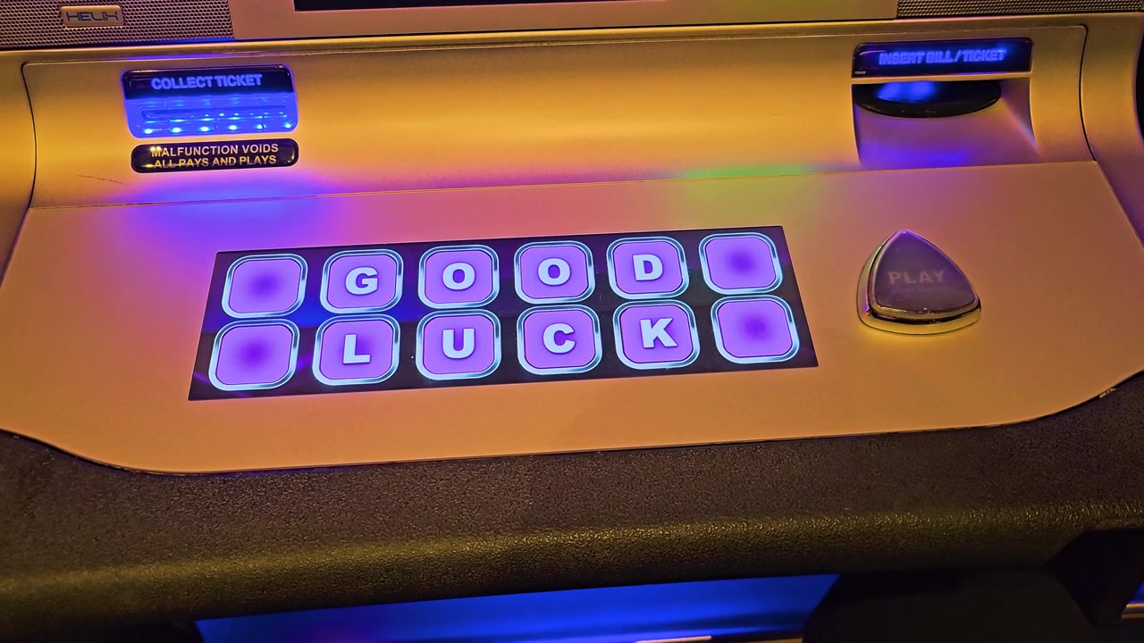 Casino player presses the illuminated play button on a modern slot machine console with colorful wager controls, ticket slots, metallic surface, and neon reflections across the gaming floor.