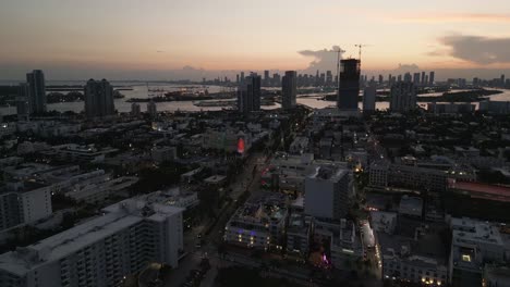 drone-revealing-south-beach-Miami-aerial-cityscape-at-sunset