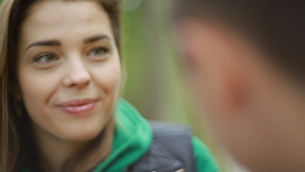 Happy Couple Drinking Tea. Young couple enjoying time in nature and drinking tea