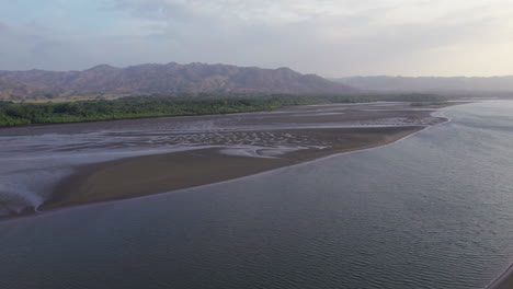 aerial panning shot revealing the terrain and forests at canas island