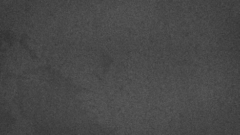 animación de marcas y manchas grises que se mueven en un bucle sin costuras sobre un fondo gris