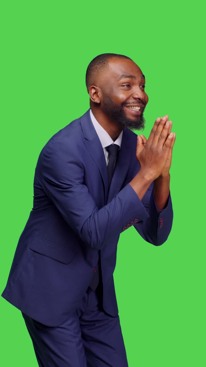 Vertical video: Side view of religious male model doing prayer hands symbol