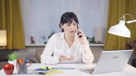 Female-student-Talking-Unhappy-On-The-Phone.