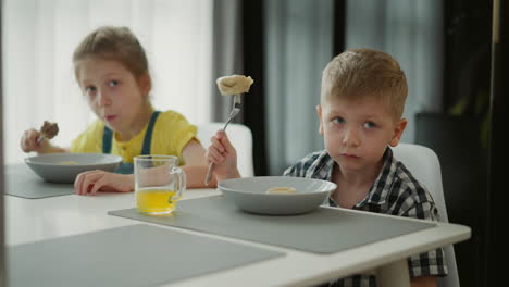 children eating dumplings