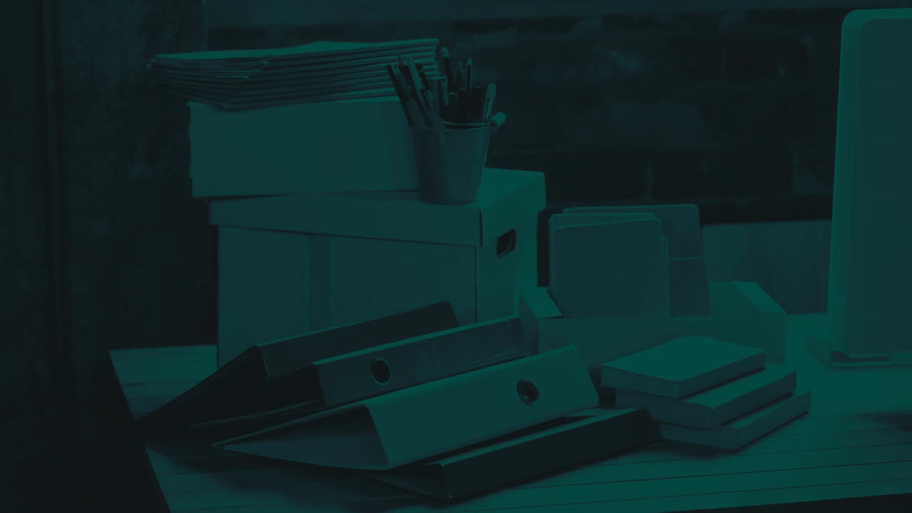 Animation of data loading on white bar graph, over desk piled with files and paperwork