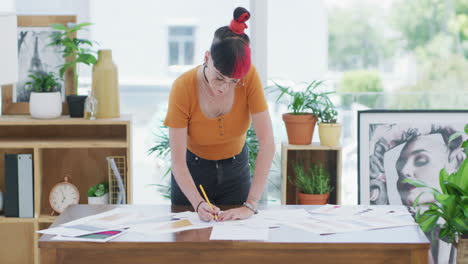 a-young-businesswoman-going-over-paperwork