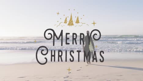 Animation-of-merry-christmas-over-biracial-senior-woman-with-surfboard-on-beach
