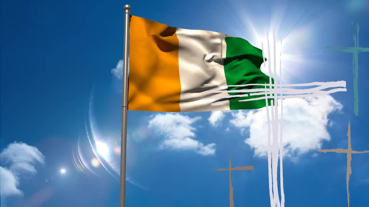 Waving Irish flag with animation of artistic cross patterns against blue sky