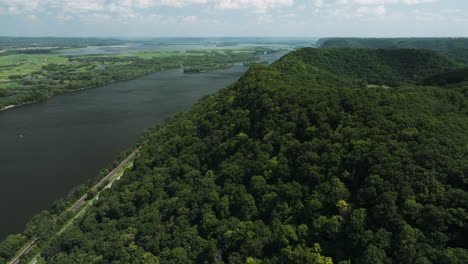 abundant forest mountains along the mississippi river near great river bluffs state park in minnesota, united states