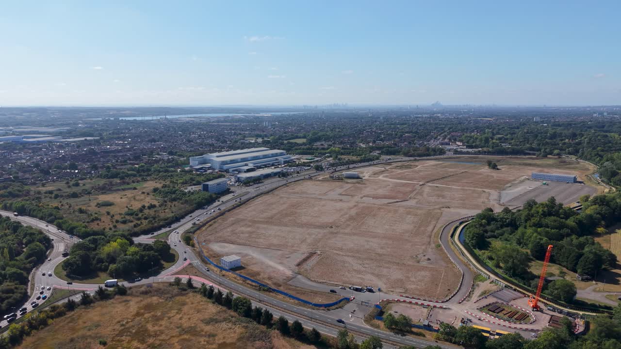 Aerial drone partial orbit over greenfield land in Waltham Cross, originally earmarked for the abandoned Sunset Studios project, and looking towards London