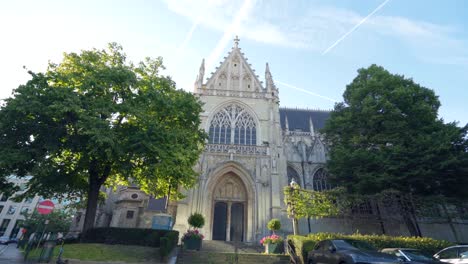 Old-Medieval-roman-catholic-Church-of-Our-Blessed-Lady-of-Sablon-in-Brussels,-Belgium-with-divine-sunlight-shining-on-it-on-warm-sunny-day