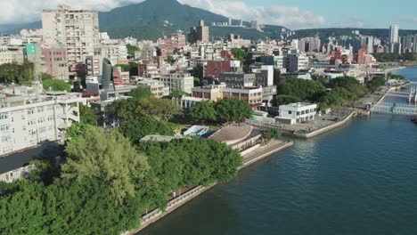 tamsui riverside view with city and mountain backdrop, taiwan, republic of china, aerial