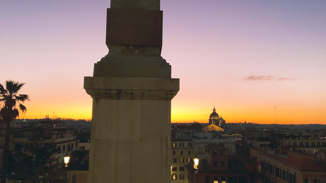 Scenic View Of Sallustian Obelisk From The Spanish Steps Viewpoint In Rome, Italy During Golden Hour - tilt down shot
