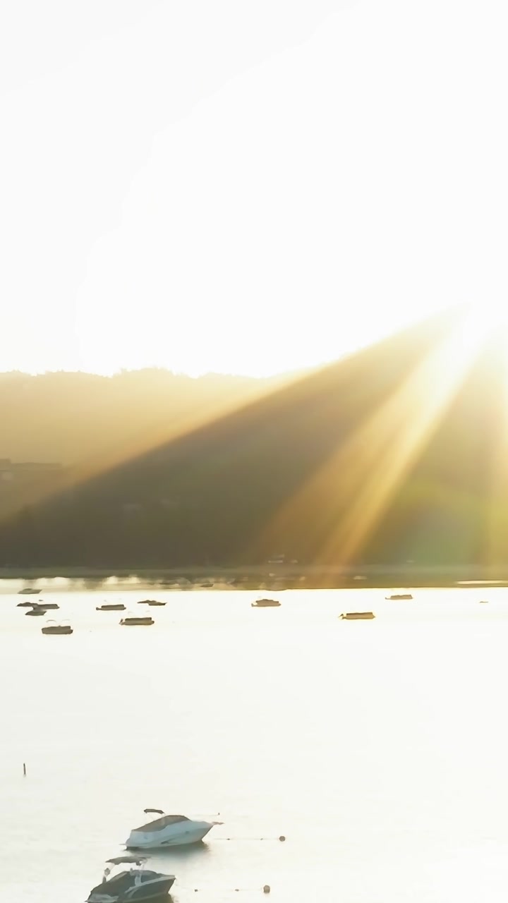 Sunset at Lake Tahoe with boats on water in Nevada and California