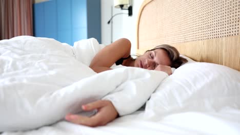 Woman Sleeping Peacefully in Bed