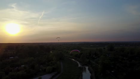 two paragliders over the river, drone aerial in australia