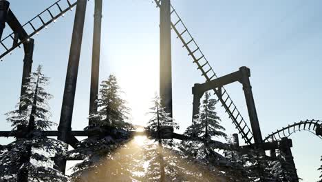 old roller coaster at sunset in forest