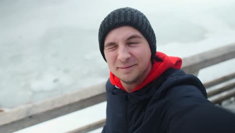 happy man in winter mountains