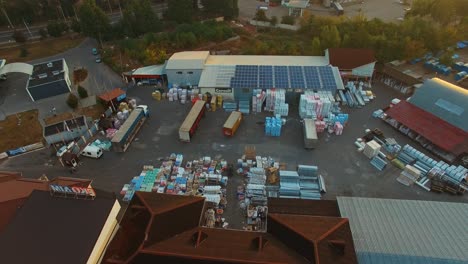 logistic transportation terminal. aerial drone view of large modern industrial warehouse