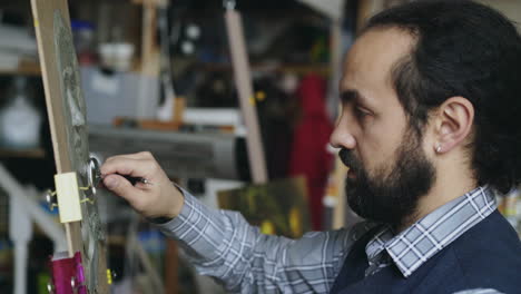sculptor working on a clay portrait